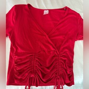 Worn a few times. It’s from Walmart. A little low cut on the chest.